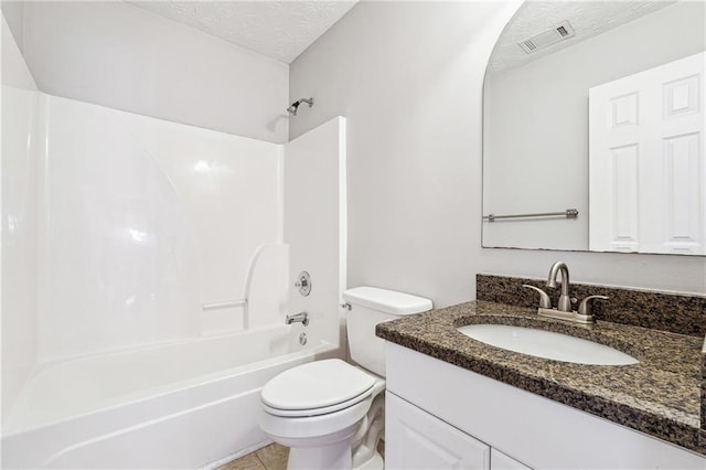 full bathroom with toilet, shower / washtub combination, tile patterned flooring, a textured ceiling, and vanity