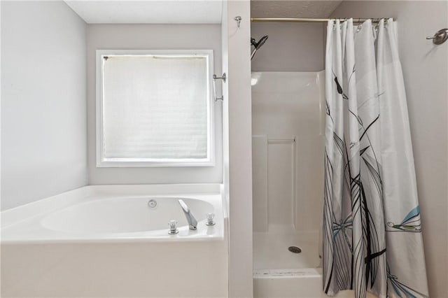 bathroom with shower with separate bathtub