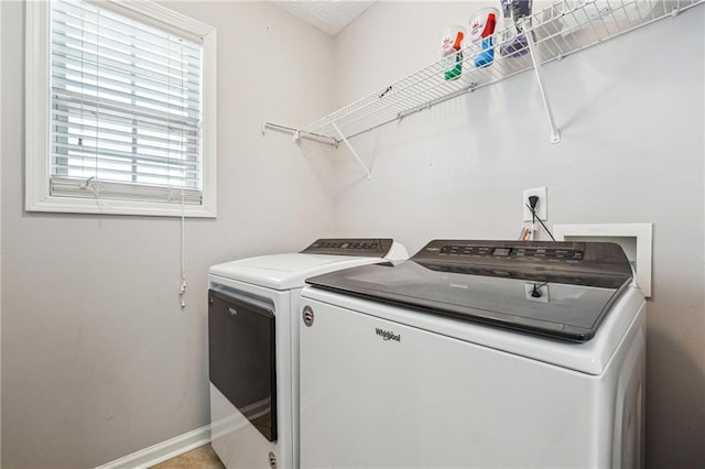 laundry area with a wealth of natural light and washer and clothes dryer