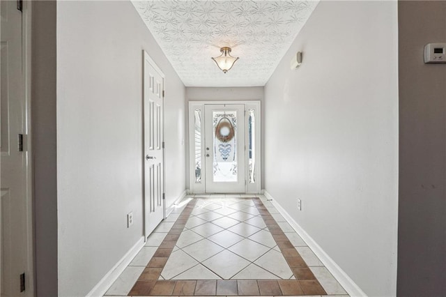 doorway with light tile patterned floors