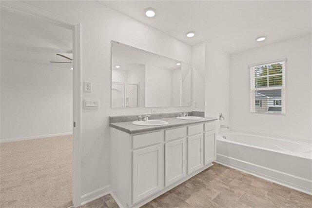 bathroom featuring shower with separate bathtub, vanity, and ceiling fan