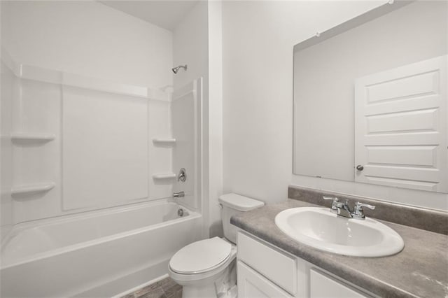 full bathroom featuring toilet, vanity, and  shower combination