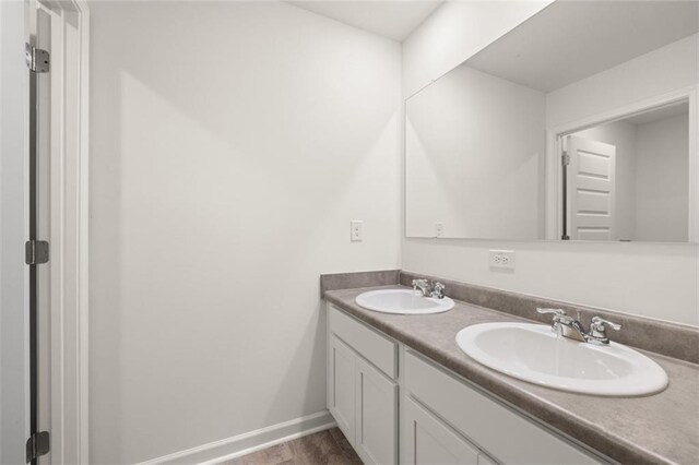 bathroom featuring vanity and wood-type flooring