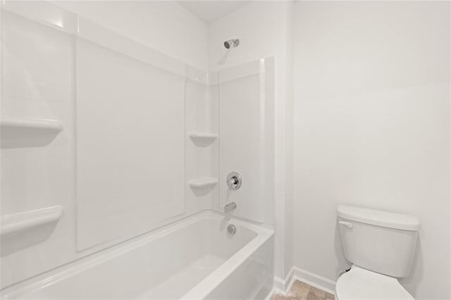 bathroom featuring toilet and tub / shower combination