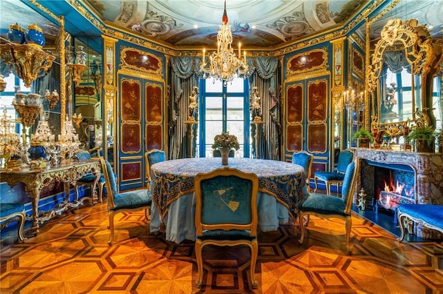 dining space with parquet floors and a notable chandelier