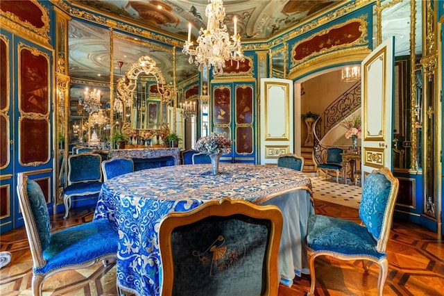 dining area featuring parquet flooring