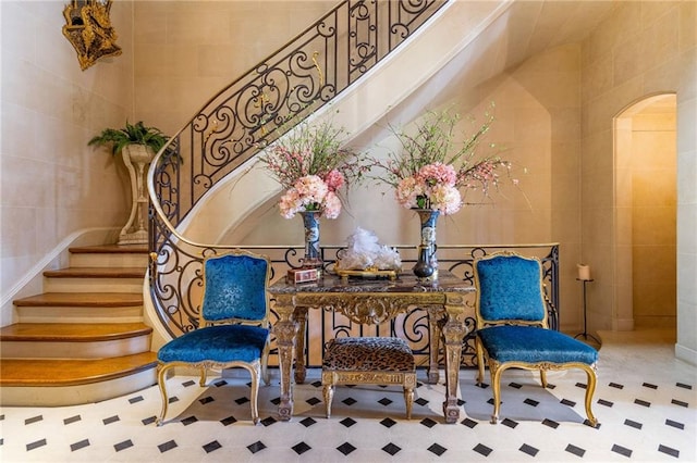 sitting room with tile walls