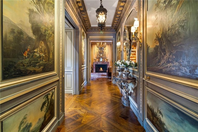 hallway with crown molding and dark parquet floors