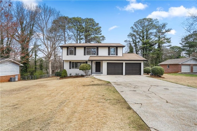 2167 Cedar Dr, Lawrenceville, GA 30043 - traditional-style home featuring a front lawn, concrete driveway, and fence