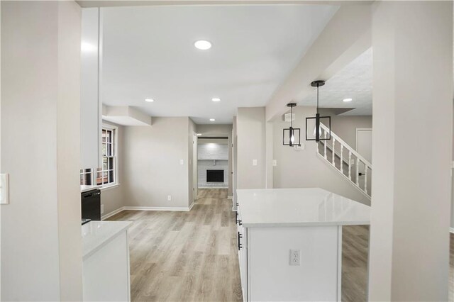 2167 Cedar Dr, Lawrenceville, GA 30043 - unfurnished living room with visible vents, wood finished floors, baseboards, a fireplace, and a raised ceiling