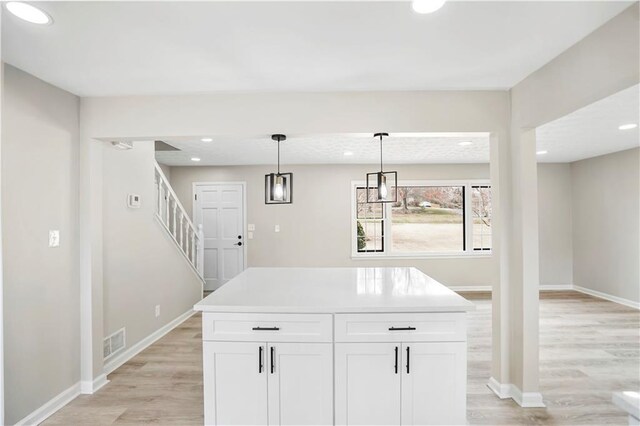 2167 Cedar Dr, Lawrenceville, GA 30043 - unfurnished room featuring visible vents, baseboards, and light wood-style floors
