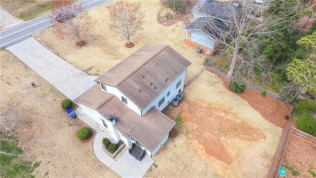 2167 Cedar Dr, Lawrenceville, GA 30043 - kitchen with a kitchen island, dishwasher, a fireplace, light wood-style floors, and white cabinetry