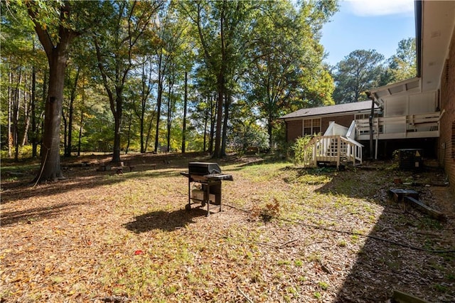 view of yard featuring a wooden deck