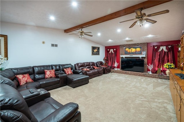 carpeted living room featuring ceiling fan, vaulted ceiling with beams, and a fireplace