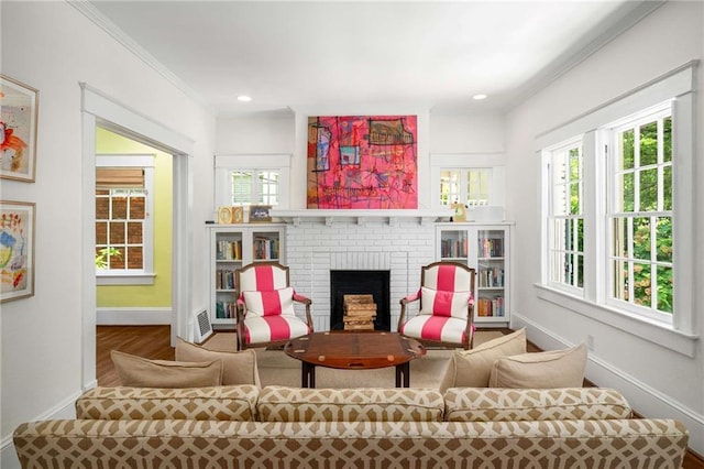 626 Elmwood Dr NE, Atlanta, GA 30306 - living area featuring a fireplace, wood finished floors, ornamental molding, and recessed lighting
