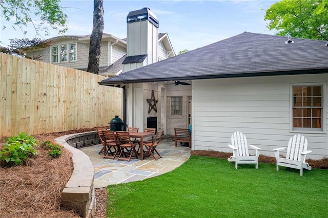 626 Elmwood Dr NE, Atlanta, GA 30306 - rear view of property with a patio, roof with shingles, ceiling fan, and a chimney