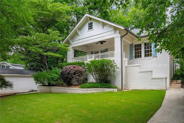 626 Elmwood Dr NE, Atlanta, GA 30306 - view of front of home featuring a front lawn, brick siding, and a porch