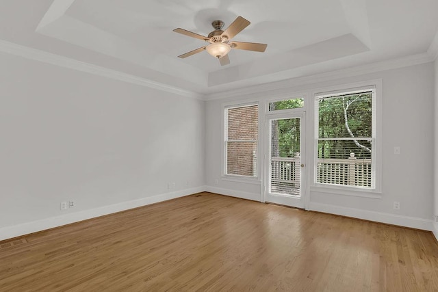 2010 Riverside Rd, Roswell, GA 30076 - empty room with a raised ceiling, light wood-type flooring, baseboards, ceiling fan, and ornamental molding