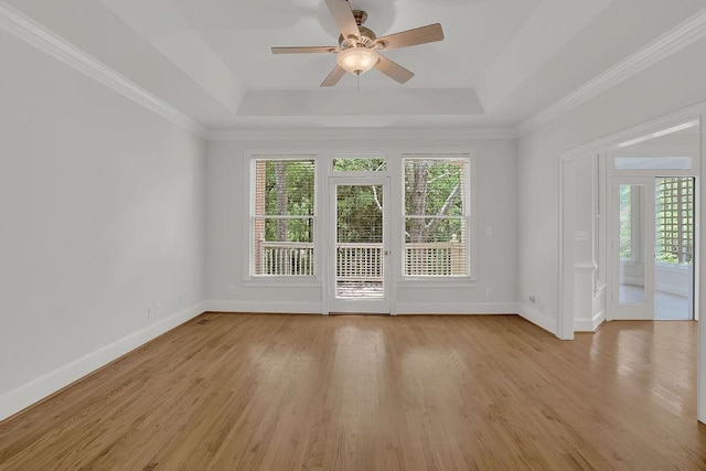 2010 Riverside Rd, Roswell, GA 30076 - spare room featuring a tray ceiling, plenty of natural light, a ceiling fan, and crown molding