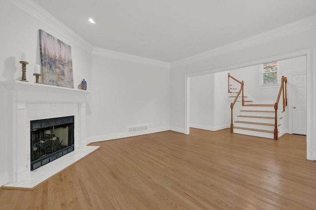 2010 Riverside Rd, Roswell, GA 30076 - unfurnished living room with stairway, wood finished floors, ornamental molding, a tiled fireplace, and baseboards
