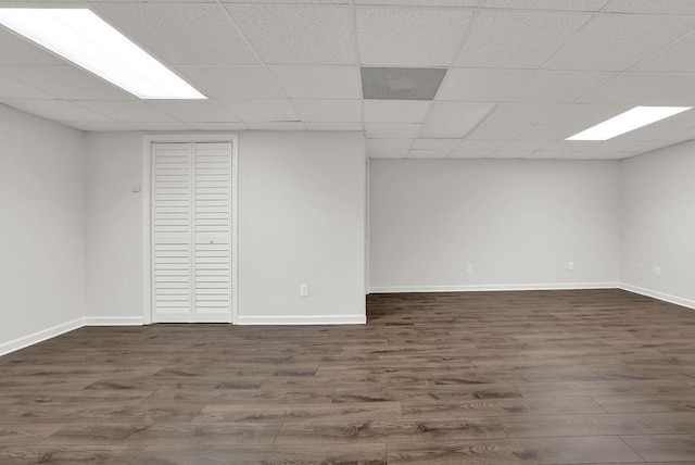 2010 Riverside Rd, Roswell, GA 30076 - finished basement with dark wood-style flooring, baseboards, and a paneled ceiling