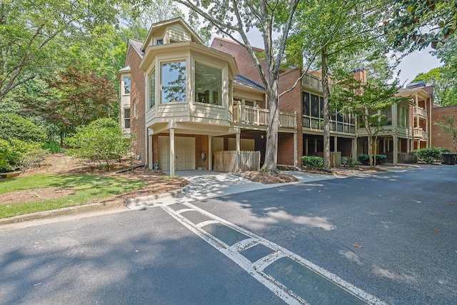 2010 Riverside Rd, Roswell, GA 30076 - view of front of property featuring an attached garage, driveway, and brick siding