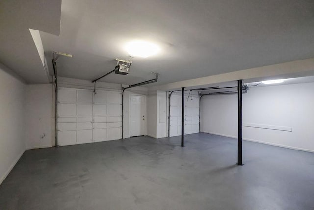 2010 Riverside Rd, Roswell, GA 30076 - garage featuring a garage door opener and baseboards