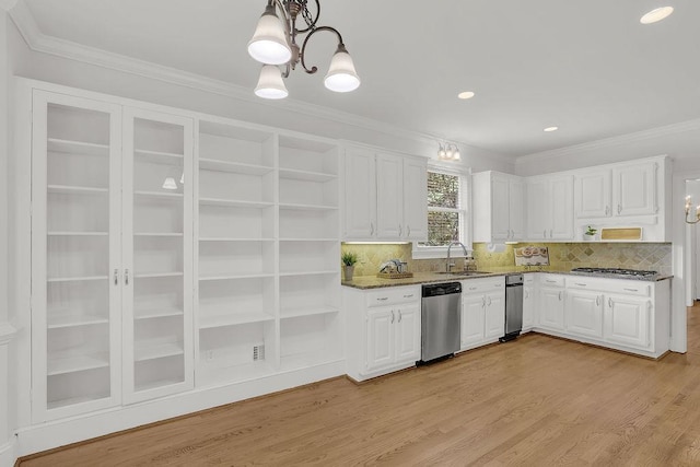 2010 Riverside Rd, Roswell, GA 30076 - kitchen with stainless steel appliances, open shelves, white cabinets, ornamental molding, and dark stone counters