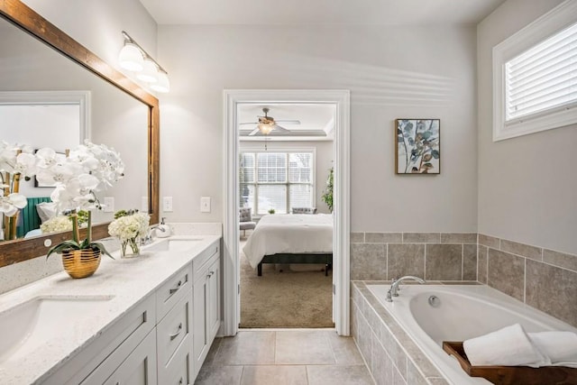 bathroom with connected bathroom, a garden tub, double vanity, tile patterned floors, and a sink