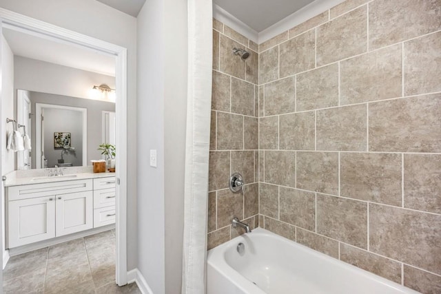 full bath with tile patterned flooring, vanity, bathing tub / shower combination, and baseboards