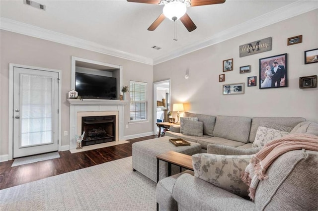 102 Blackstone Ct, Kathleen, GA 31047 - living area featuring wood finished floors, ceiling fan, ornamental molding, a fireplace with flush hearth, and baseboards
