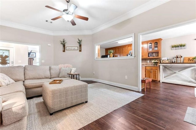102 Blackstone Ct, Kathleen, GA 31047 - living area featuring a ceiling fan, dark wood-type flooring, crown molding, and baseboards