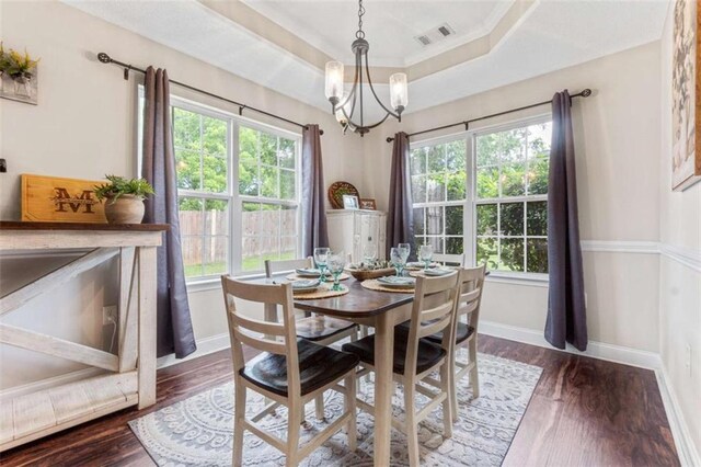 102 Blackstone Ct, Kathleen, GA 31047 - dining room featuring a chandelier, baseboards, wood finished floors, and a tray ceiling