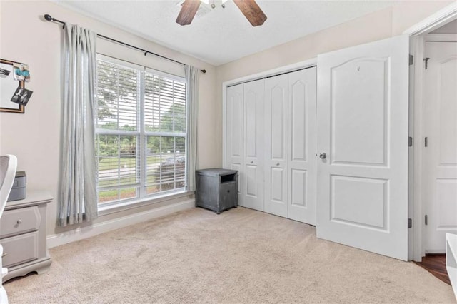 102 Blackstone Ct, Kathleen, GA 31047 - unfurnished bedroom featuring carpet flooring, a closet, a ceiling fan, and baseboards