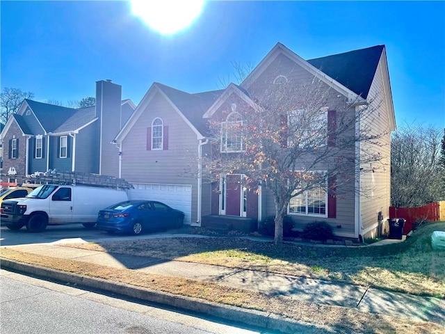 front facade with a garage