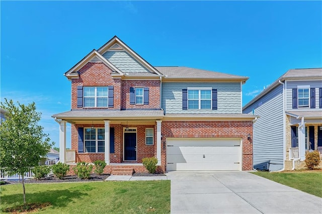 craftsman inspired home with driveway, brick siding, a garage, and a front yard