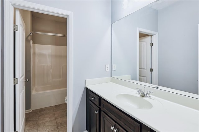 full bath with shower / bathing tub combination, vanity, toilet, and tile patterned floors