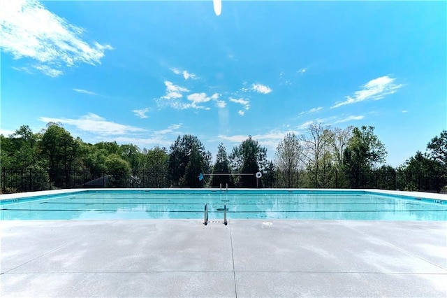 community pool with a patio area