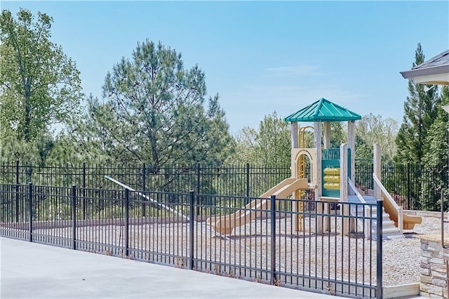 communal playground featuring fence