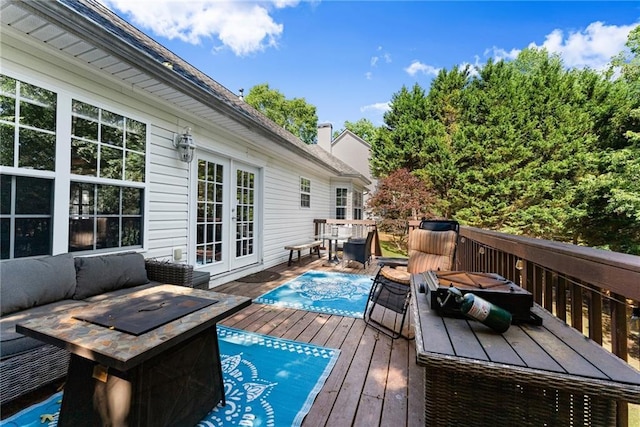 5995 Wellington Ave, Gainesville, GA 30506 - deck with french doors, outdoor dining space, and an outdoor fire pit