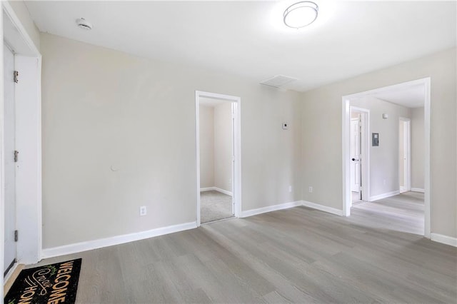 empty room with light hardwood / wood-style floors