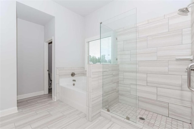 72 Whistling Dr, Jefferson, GA 30549 - full bathroom featuring a shower stall, a garden tub, and baseboards
