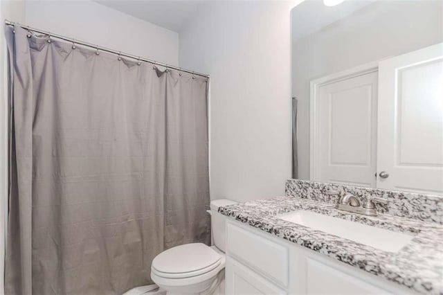 72 Whistling Dr, Jefferson, GA 30549 - full bathroom with vanity, toilet, and a shower with shower curtain
