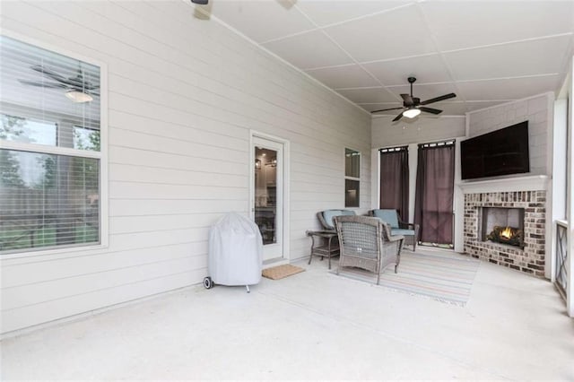 72 Whistling Dr, Jefferson, GA 30549 - view of patio / terrace featuring ceiling fan, an outdoor brick fireplace, and grilling area