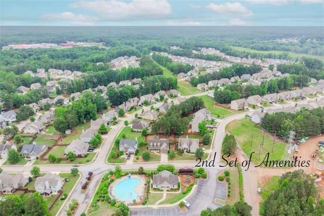 72 Whistling Dr, Jefferson, GA 30549 - view of property location featuring nearby suburban area, a heavily wooded area, and a pool area