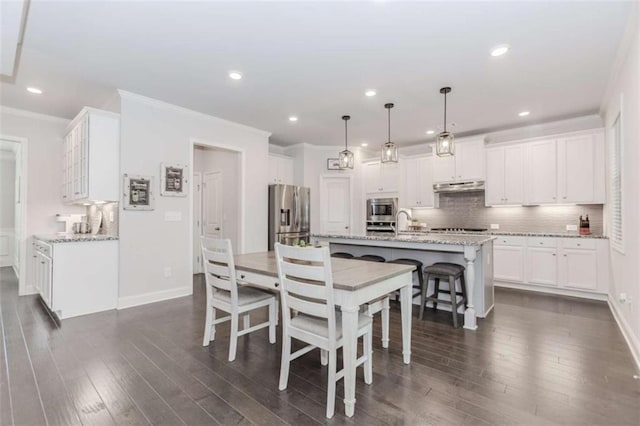72 Whistling Dr, Jefferson, GA 30549 - dining area with ornamental molding, recessed lighting, dark wood-style floors, and baseboards