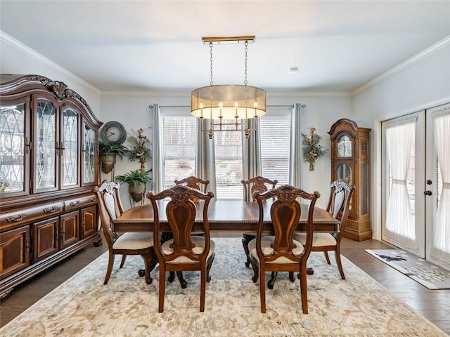 dining space with crown molding and a wealth of natural light