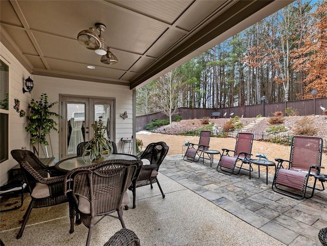 view of patio featuring french doors and ceiling fan