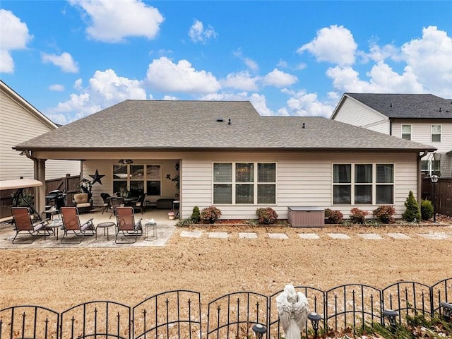 back of property with a patio