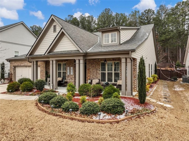 view of front of home with a garage and covered porch